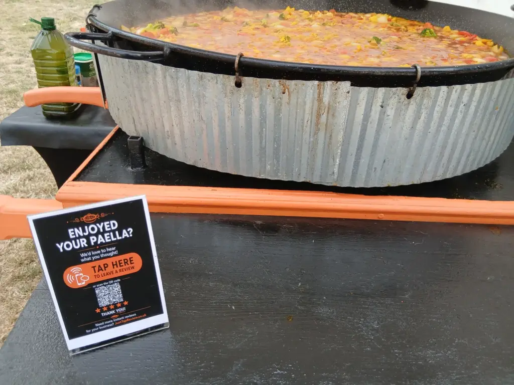 Just Tap Review Google review stand used at a Your Paella catering event